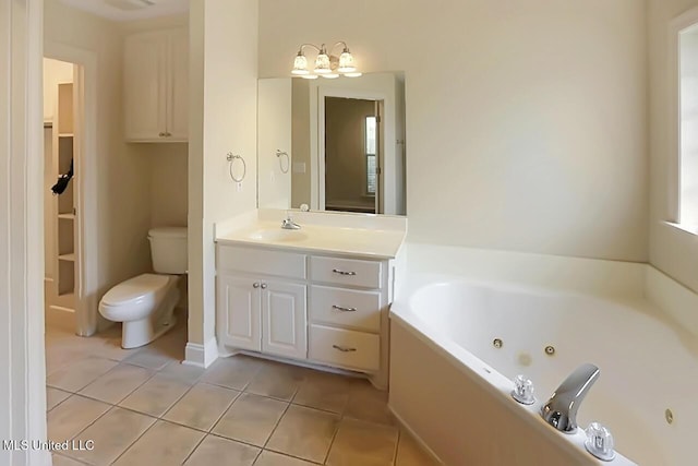 503 W Abbey Pl, Brandon, MS 39047 - full bath with tile patterned flooring, a tub with jets, vanity, and a chandelier