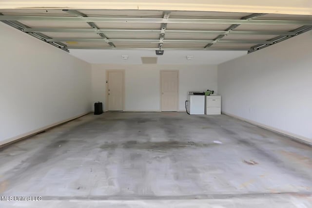 503 W Abbey Pl, Brandon, MS 39047 - garage with separate washer and dryer and a garage door opener