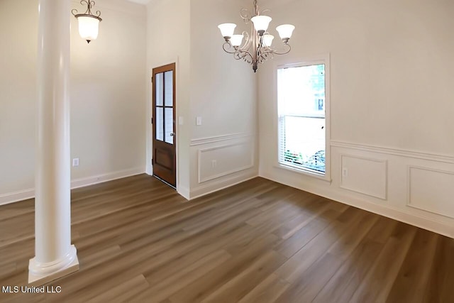 503 W Abbey Pl, Brandon, MS 39047 - foyer entrance with dark wood-type flooring, a chandelier, a wainscoted wall, and a decorative wall