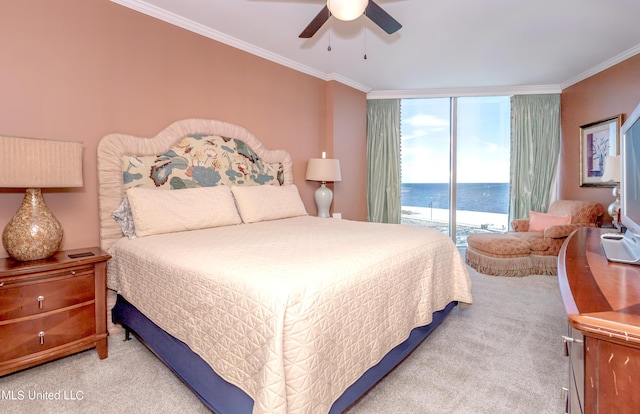 bedroom featuring access to exterior, ceiling fan, a water view, and light carpet