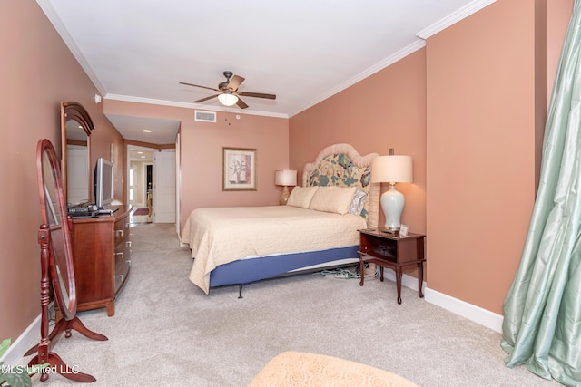 bedroom with ceiling fan, light colored carpet, and crown molding