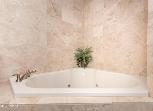 bathroom featuring tiled tub