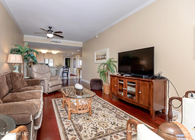 living room with ceiling fan, ornamental molding, and dark wood-type flooring