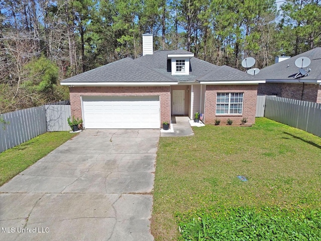 view of front of home featuring a front yard, fence, driveway, an attached garage, and a chimney