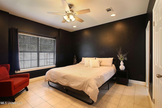 bedroom with ceiling fan, visible vents, baseboards, and light tile patterned flooring