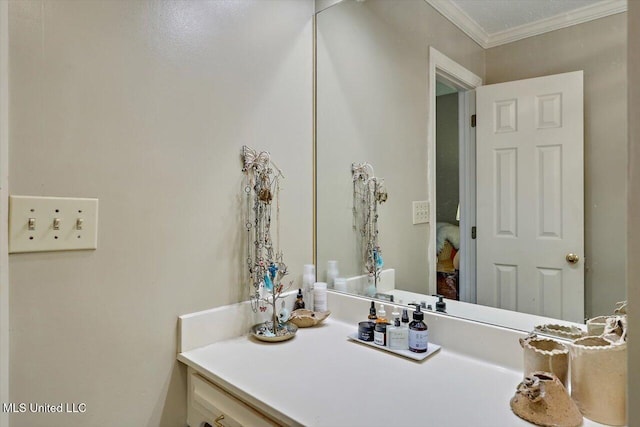 bathroom featuring vanity and ornamental molding