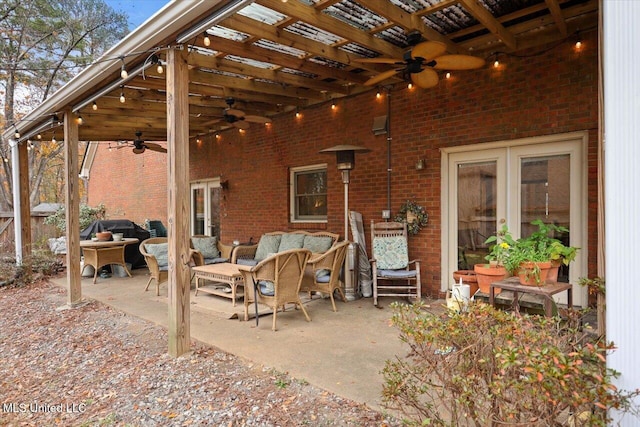 view of patio featuring an outdoor living space and ceiling fan