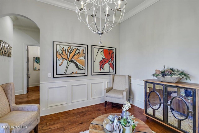 sitting room featuring crown molding and dark hardwood / wood-style floors