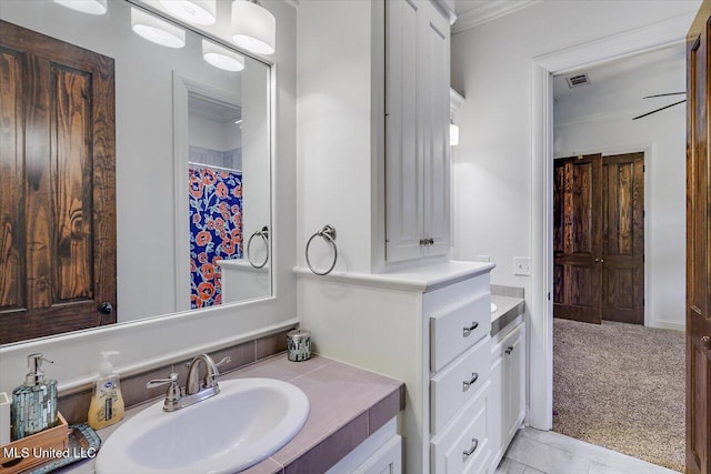 bathroom featuring vanity and ornamental molding