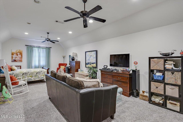 living room with ceiling fan, lofted ceiling, and light carpet