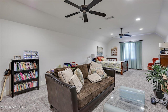 carpeted living room with vaulted ceiling and ceiling fan