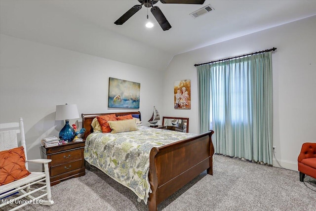 bedroom featuring lofted ceiling, light colored carpet, and ceiling fan