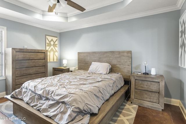 bedroom with ceiling fan, baseboards, a tray ceiling, and ornamental molding