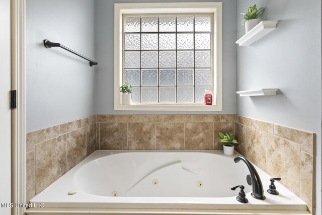 full bathroom with a wealth of natural light and a tub with jets