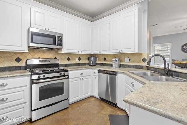 kitchen with tasteful backsplash, visible vents, crown molding, stainless steel appliances, and a sink