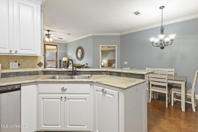 kitchen featuring visible vents, ornamental molding, a sink, stainless steel dishwasher, and tasteful backsplash