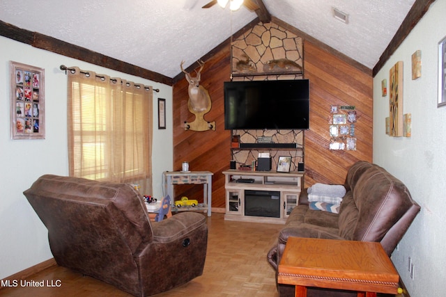 19901 Otis Cooper Rd, Moss Point, MS 39562 - living room featuring a large fireplace, lofted ceiling with beams, a textured ceiling, a ceiling fan, and wood walls