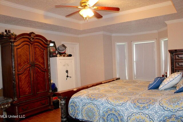19901 Otis Cooper Rd, Moss Point, MS 39562 - bedroom featuring a textured ceiling and ceiling fan