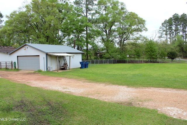 19901 Otis Cooper Rd, Moss Point, MS 39562 - view of yard with an outbuilding, fence, and dirt driveway