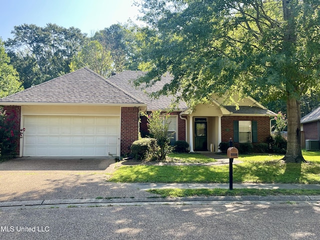 110 Cowles Creek Rd, Clinton, MS 39056 - view of front of property featuring an attached garage, driveway, brick siding, a front yard, and a shingled roof