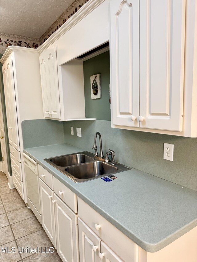 110 Cowles Creek Rd, Clinton, MS 39056 - kitchen featuring a sink, white dishwasher, white cabinets, light tile patterned flooring, and a textured ceiling