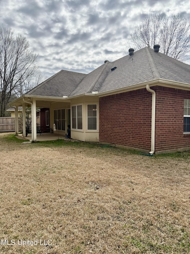 110 Cowles Creek Rd, Clinton, MS 39056 - rear view of property with a patio area, brick siding, and a shingled roof