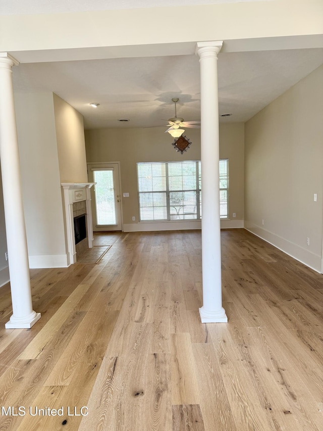 110 Cowles Creek Rd, Clinton, MS 39056 - unfurnished living room with a ceiling fan, plenty of natural light, decorative columns, and light wood finished floors