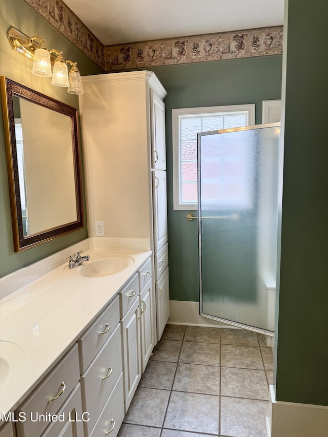 110 Cowles Creek Rd, Clinton, MS 39056 - full bath featuring a stall shower, double vanity, and tile patterned floors