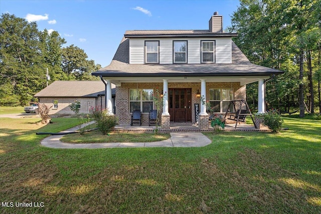 view of front facade with a porch and a front lawn