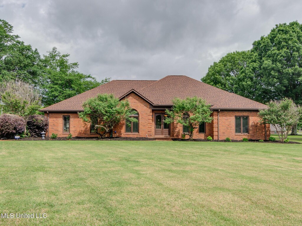 3480 Hillsdale Dr, Olive Branch, MS 38654 - single story home with a shingled roof, a front lawn, and brick siding