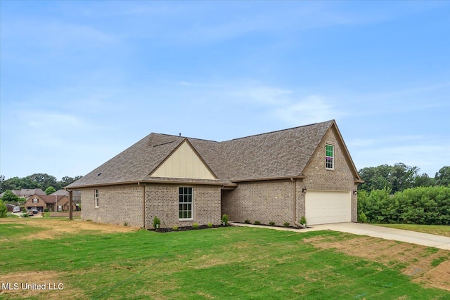 view of front of house with a front yard and a garage