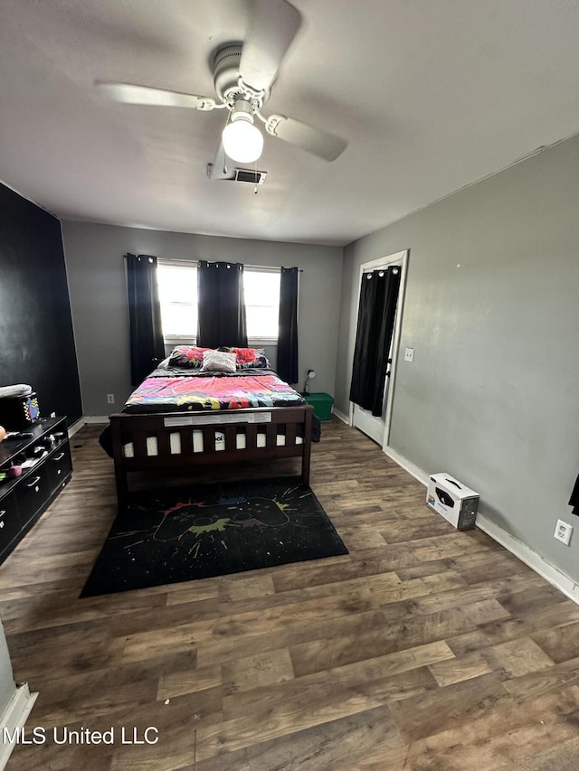 1420 S 9th Ave, Columbus, MS 39701 - bedroom with baseboards, a ceiling fan, dark wood finished floors, and visible vents