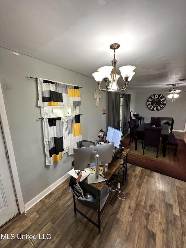 1420 S 9th Ave, Columbus, MS 39701 - dining area featuring baseboards, wood finished floors, and ceiling fan with notable chandelier