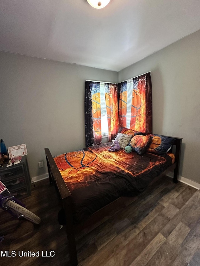 1420 S 9th Ave, Columbus, MS 39701 - bedroom with baseboards and wood finished floors