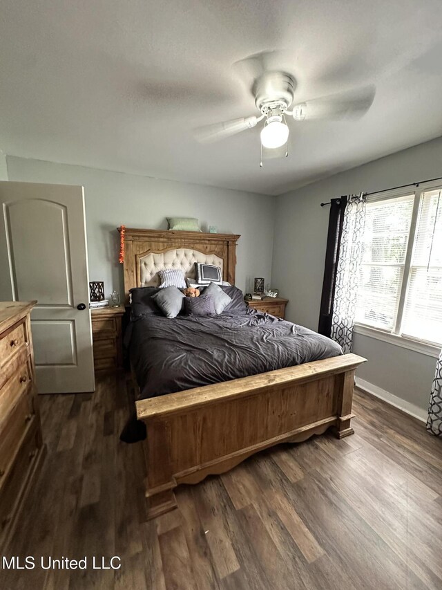 1420 S 9th Ave, Columbus, MS 39701 - bedroom with baseboards, a ceiling fan, and dark wood-style floors