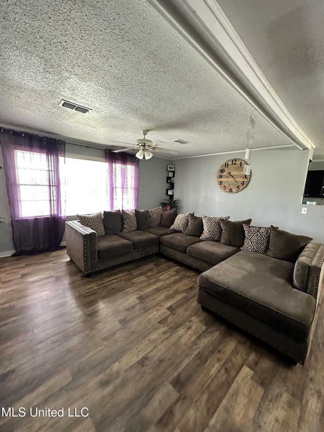 1420 S 9th Ave, Columbus, MS 39701 - living area with a ceiling fan, a textured ceiling, visible vents, wood finished floors, and a wealth of natural light