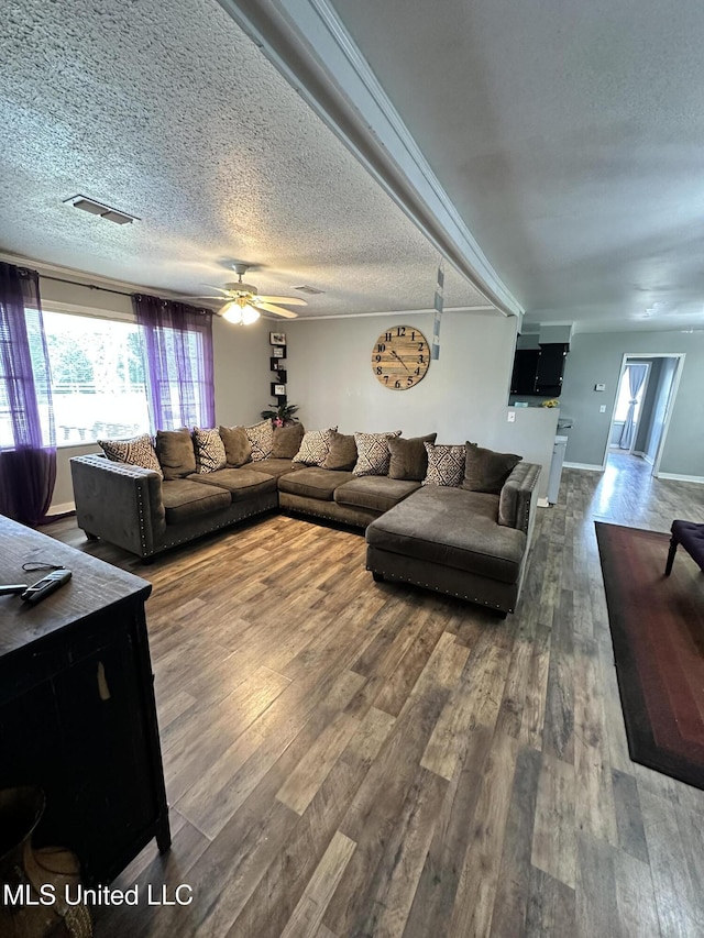 1420 S 9th Ave, Columbus, MS 39701 - living area with visible vents, ceiling fan, wood finished floors, and a healthy amount of sunlight
