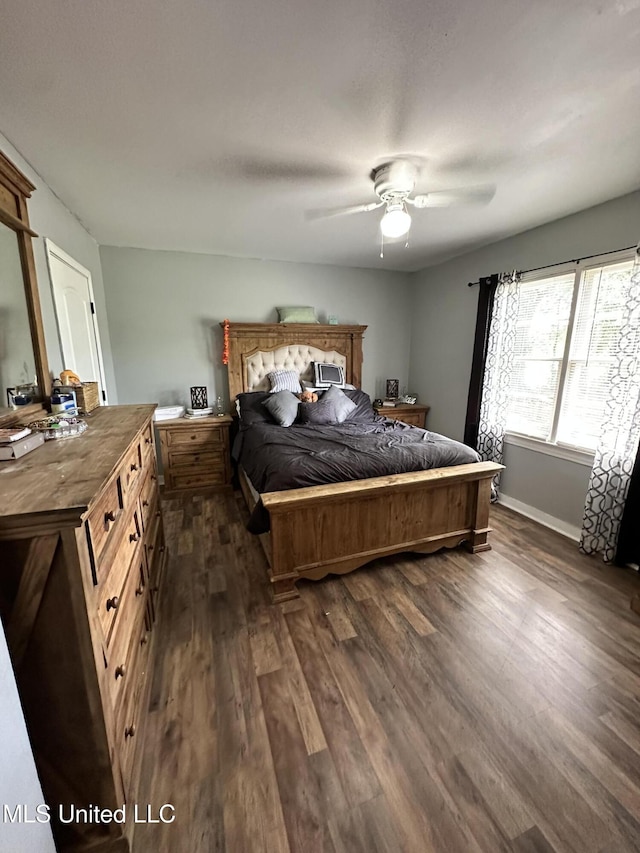 1420 S 9th Ave, Columbus, MS 39701 - bedroom featuring baseboards, ceiling fan, and dark wood-style flooring