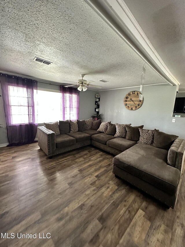 1420 S 9th Ave, Columbus, MS 39701 - living area with a ceiling fan, a textured ceiling, visible vents, wood finished floors, and a wealth of natural light