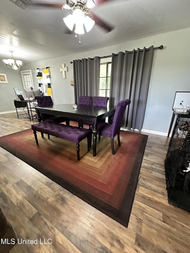 1420 S 9th Ave, Columbus, MS 39701 - dining area featuring baseboards, ceiling fan with notable chandelier, and wood finished floors