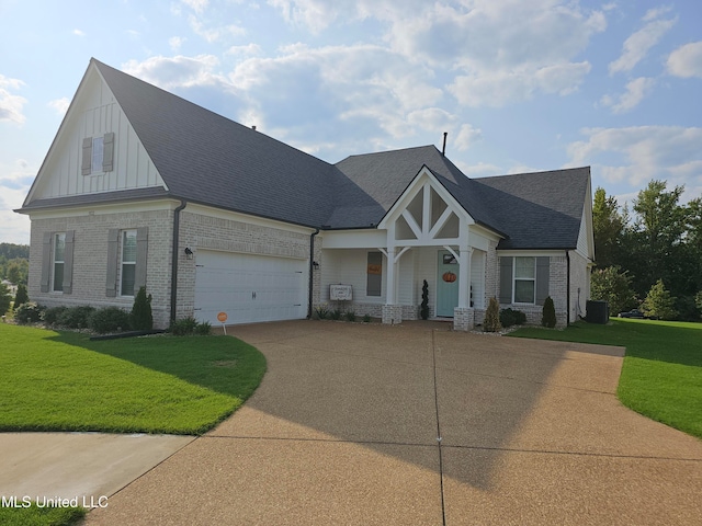 craftsman house featuring a front yard, cooling unit, and a garage