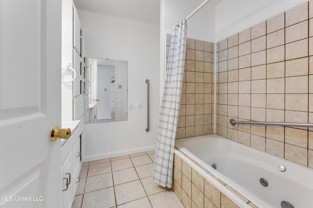 bathroom featuring vanity, tile patterned flooring, and a combined bath / shower with jetted tub