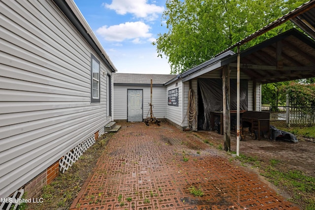 view of home's exterior with fence