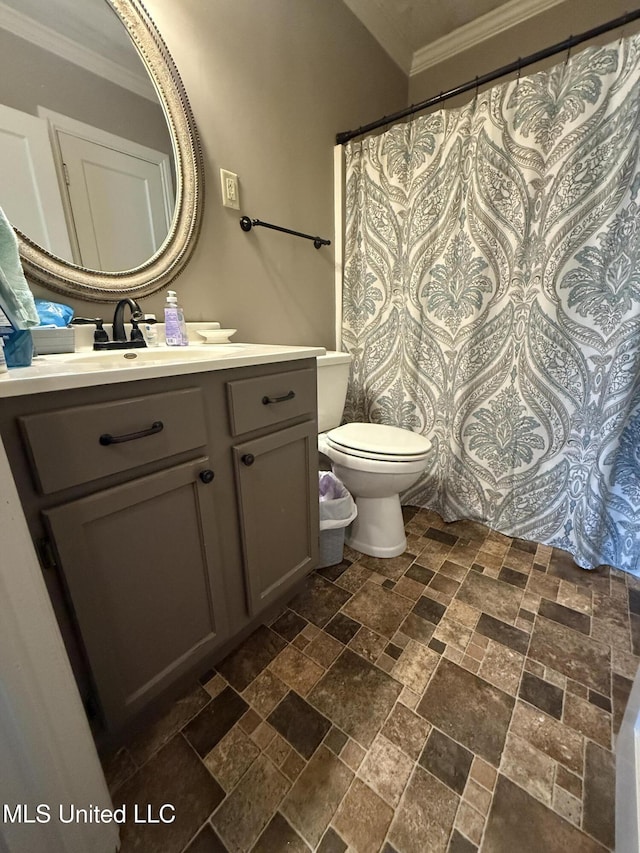 bathroom with a shower with curtain, crown molding, vanity, toilet, and stone tile flooring