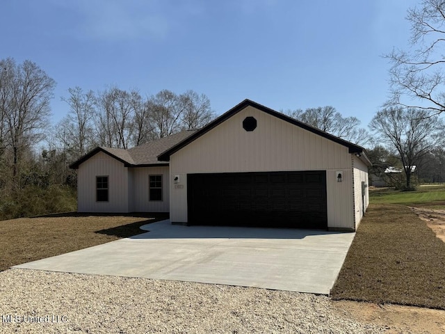 view of front facade featuring an attached garage and concrete driveway