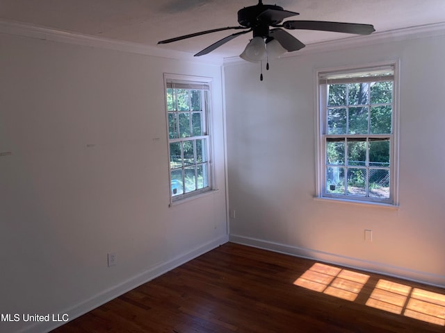 spare room with crown molding, dark hardwood / wood-style flooring, plenty of natural light, and ceiling fan