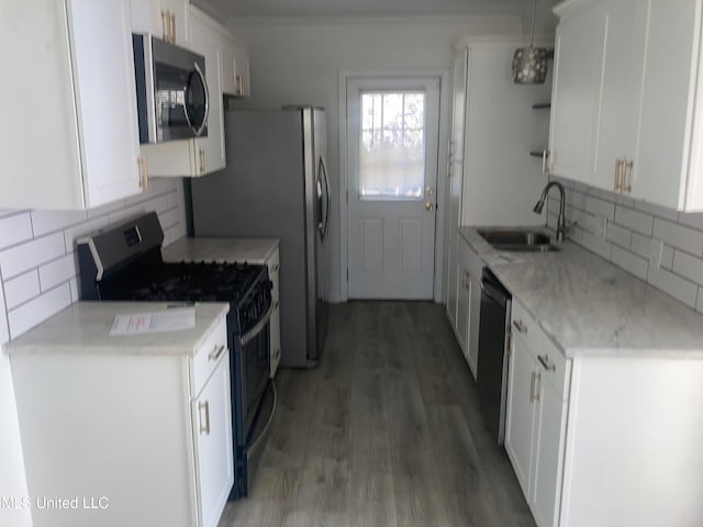 kitchen featuring white cabinets, backsplash, black appliances, dark wood-type flooring, and sink