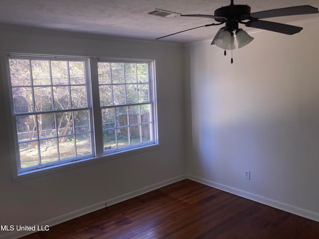 unfurnished room with ceiling fan, a textured ceiling, a wealth of natural light, and hardwood / wood-style floors