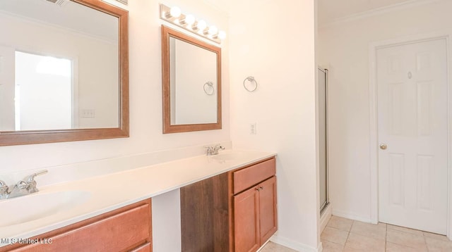 full bath featuring tile patterned floors, a shower with door, a sink, and double vanity