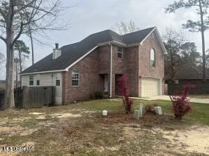 view of front of property with concrete driveway and an attached garage